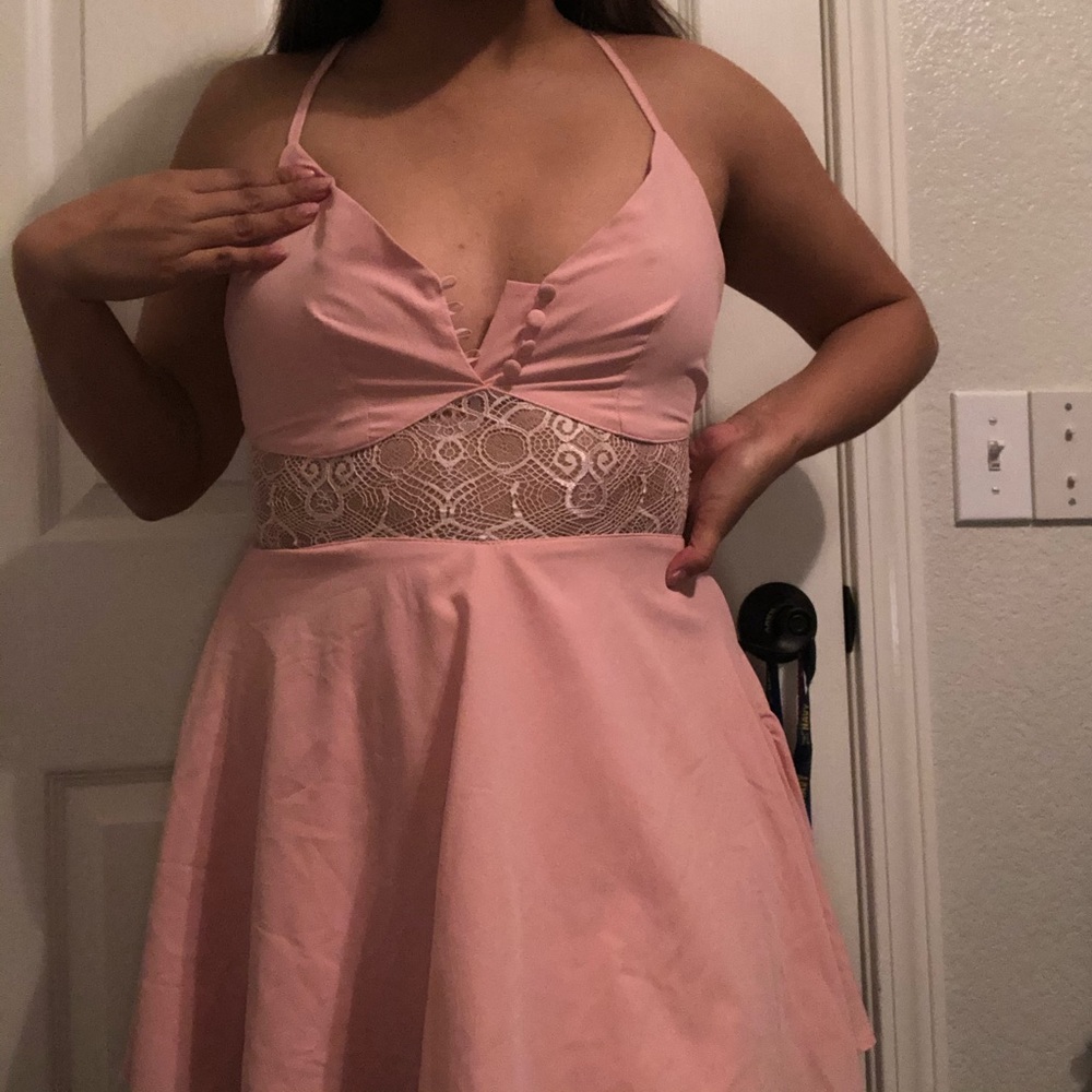Pink dress with lace detailing at the midriff